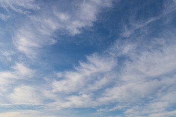 Patchy white clouds on blue sky.