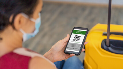covid-19 vaccination certificate with QR code on smartphone application