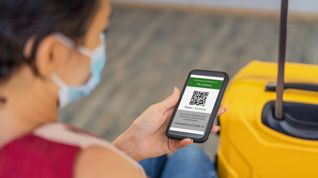 covid-19 vaccination certificate with QR code on smartphone application