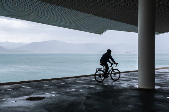 silhouette of man on bicycle