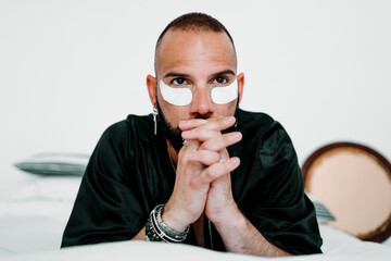 Attractive man taking care of himself at home