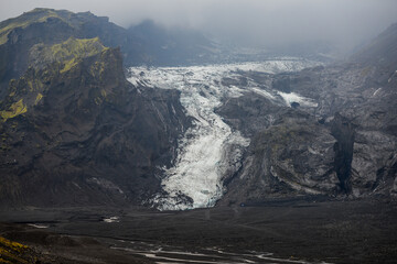 The Gígjökull glacier tumbling down the Eyjafjallajökull volcano ice cap to the wasteland caused...