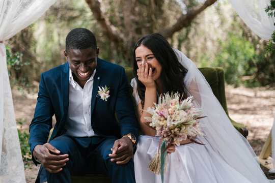 Couple laughs out loud during wedding