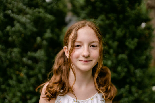 portrait of beautiful tween with red hair 