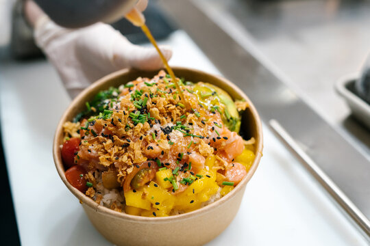 Salmon poke bowl with sauce