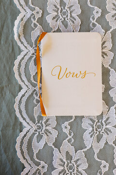 Vows booklet on lace