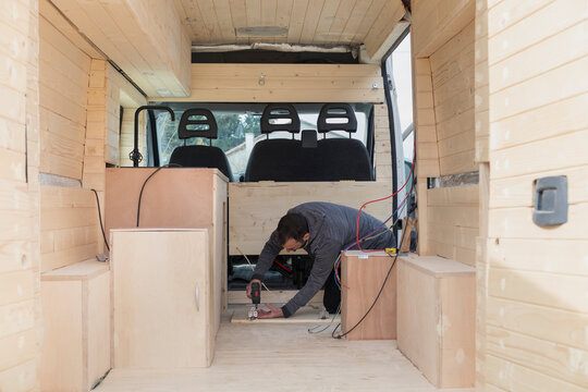 Man Building Kitchen in Camper Van 