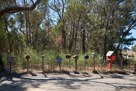 Row of homemade mailboxes in county 