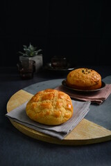 freshly baked Hong Kong Macau butter crispy skin polo bun in dark background pastry halal menu