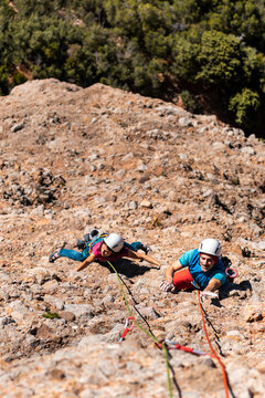 Climbing buddies doing a multipitch route