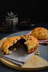 freshly baked Hong Kong Macau butter crispy skin polo bun in dark background pastry halal menu