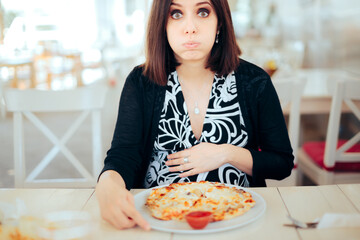 Unhappy Nauseated Pregnant Woman Trying to Eat Pizza 