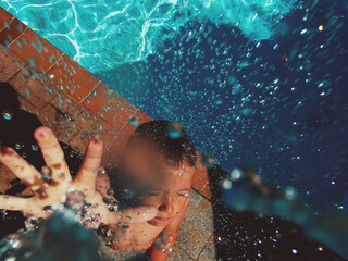 Swimming pool, boy boy in the shower.