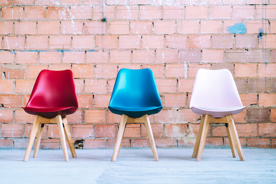 Chairs on brick wall