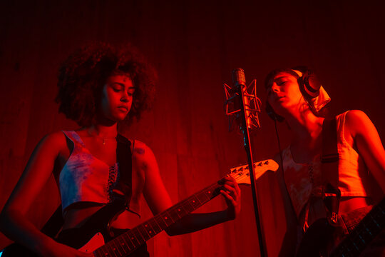 Female Musician Playing Music In The Studio.