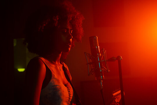 Female Musician Playing Music In The Studio.