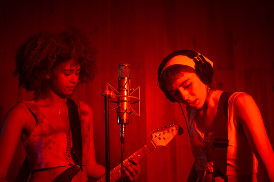Female Musician Playing Music In The Studio.