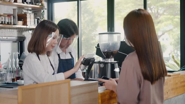 QR code payment, customer woman using digital smartphone application scanning QR code payment without money for buying coffee in cafe coffee shop, small business accepts digital payment