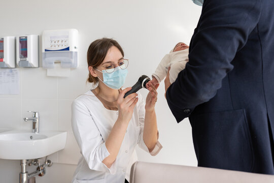 Doctor examining toddle skin