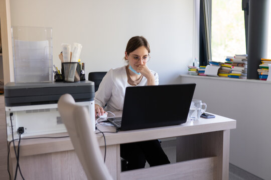 Doctor Using Laptop At Her Room