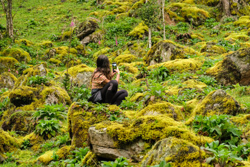 Woman taking a picture in wonderful place, La Chorrera, Choachi, Colombia.