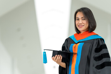 PhD graduate in black gown University bachelor degree.