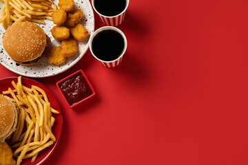 Different fast food on red background, flat lay. Space for text - Powered by Adobe