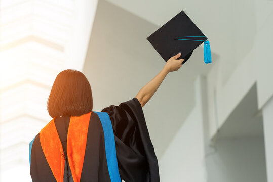 PhD graduate in black gown University bachelor degree.