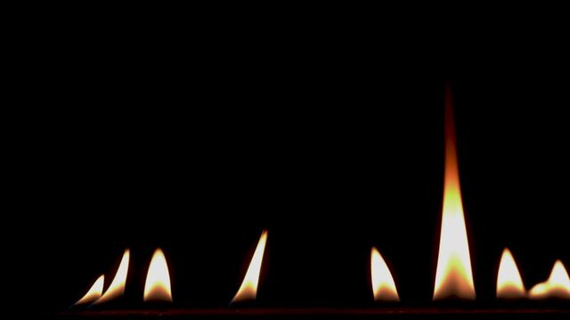 B roll of Close-up of flames burning slow motion background footage. Flames fire on black background. Burning fire. Bonfire. 