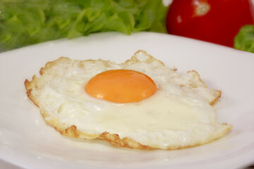 the egg fried as piece of food, full nutritious breakfast, object of food on ware.