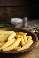 Fresh baby corn cobs on wooden table