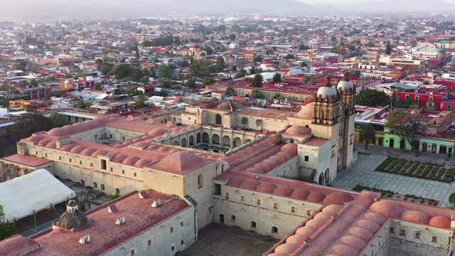 Downtown Oaxaca, Mexico, Flying Above Santo Domingo de Guzman Church Complex and Downtown With Cityscape Skyline in Background, Drone Aerial View