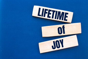 Text lifetime of joy on the short note texture background