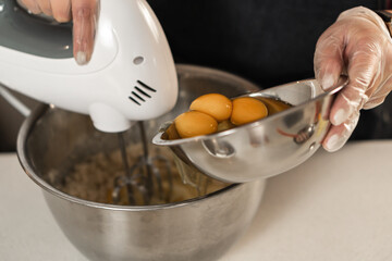 beating cake mix to whip with the egg yolks about to be added