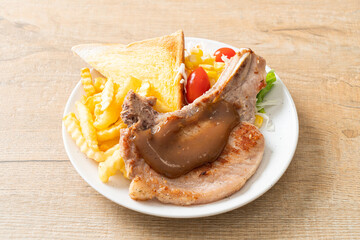 pork chop steak with chips and mini salad