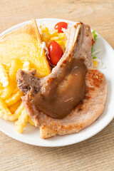 pork chop steak with chips and mini salad
