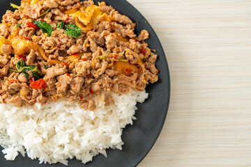 stir-fried minced pork with basil and egg topped on rice