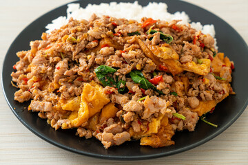 stir-fried minced pork with basil and egg topped on rice