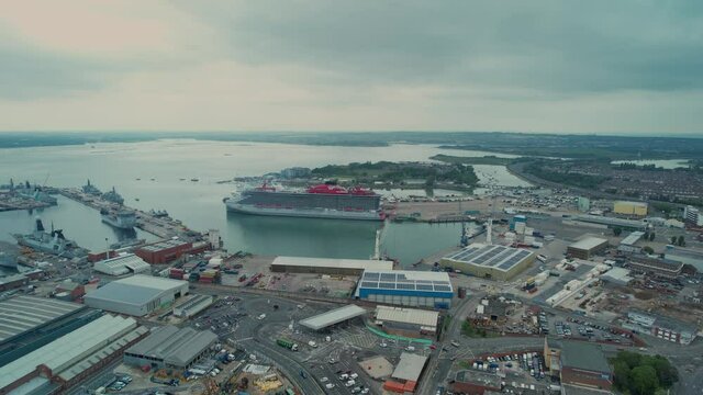 Cruise Ship Anchored At The Pier Of Portsmouth In UK. Scarlet Lady By Virgin Voyages. aerial