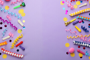 Flat lay composition with carnival items on violet background. Space for text