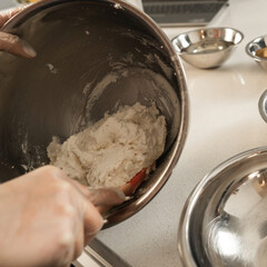 Transferring buttercream from one metal bowl to another