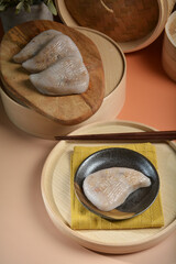 traditional chinese teo chew steam salted sticky rice peach cake kueh snack appetiser food with beautiful display and color halal dim sum menu