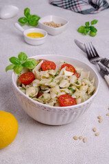 Shell pasta with tomatoes and pesto