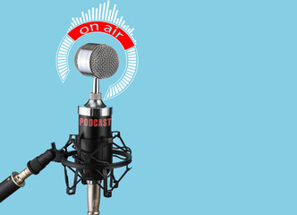 Modern microphone on color background