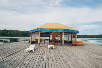 View of the gazebo by the lake. recreation area by the water