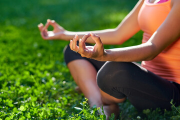 Yoga. Young woman practicing yoga or dancing or stretching in nature at park. Health lifestyle concept