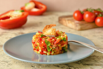Plate with tasty tartare salad on color background, closeup