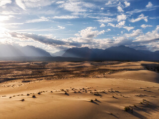 Naklejka na ściany i meble Endless desert and blue sky. Heat and drought. Enchanting landscape.