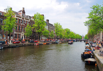    the  picturesque  prinsengracht canal, boats,  and 17th century  historic architecture during...