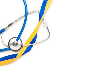 Doctor's stethoscope and ribbon in colors of Ukrainian flag on white background